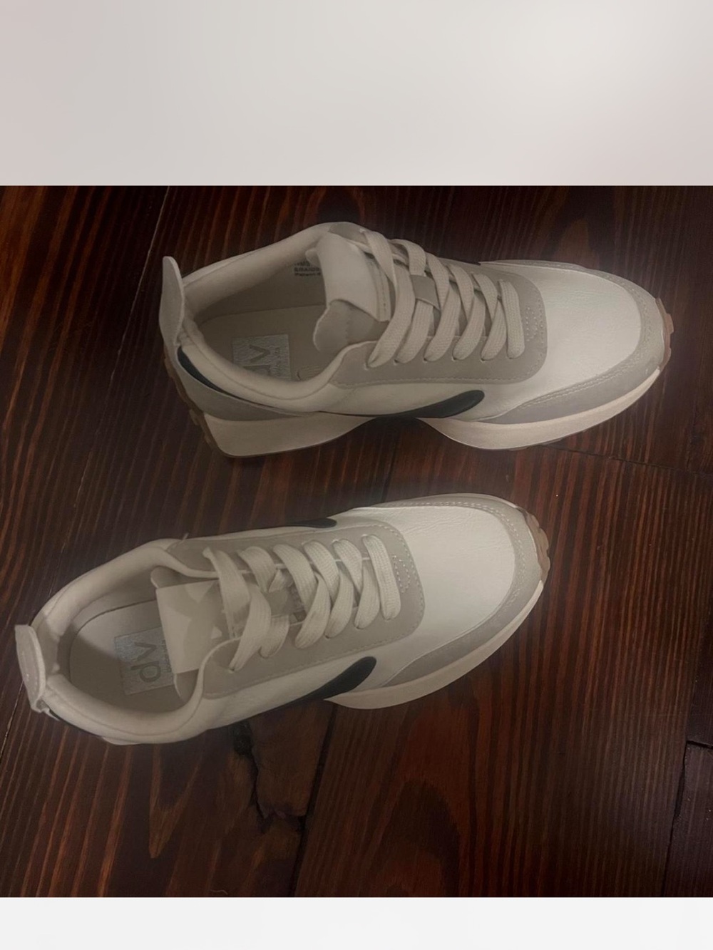 Like new has a some tear my toes Dolce Vita White shoes
